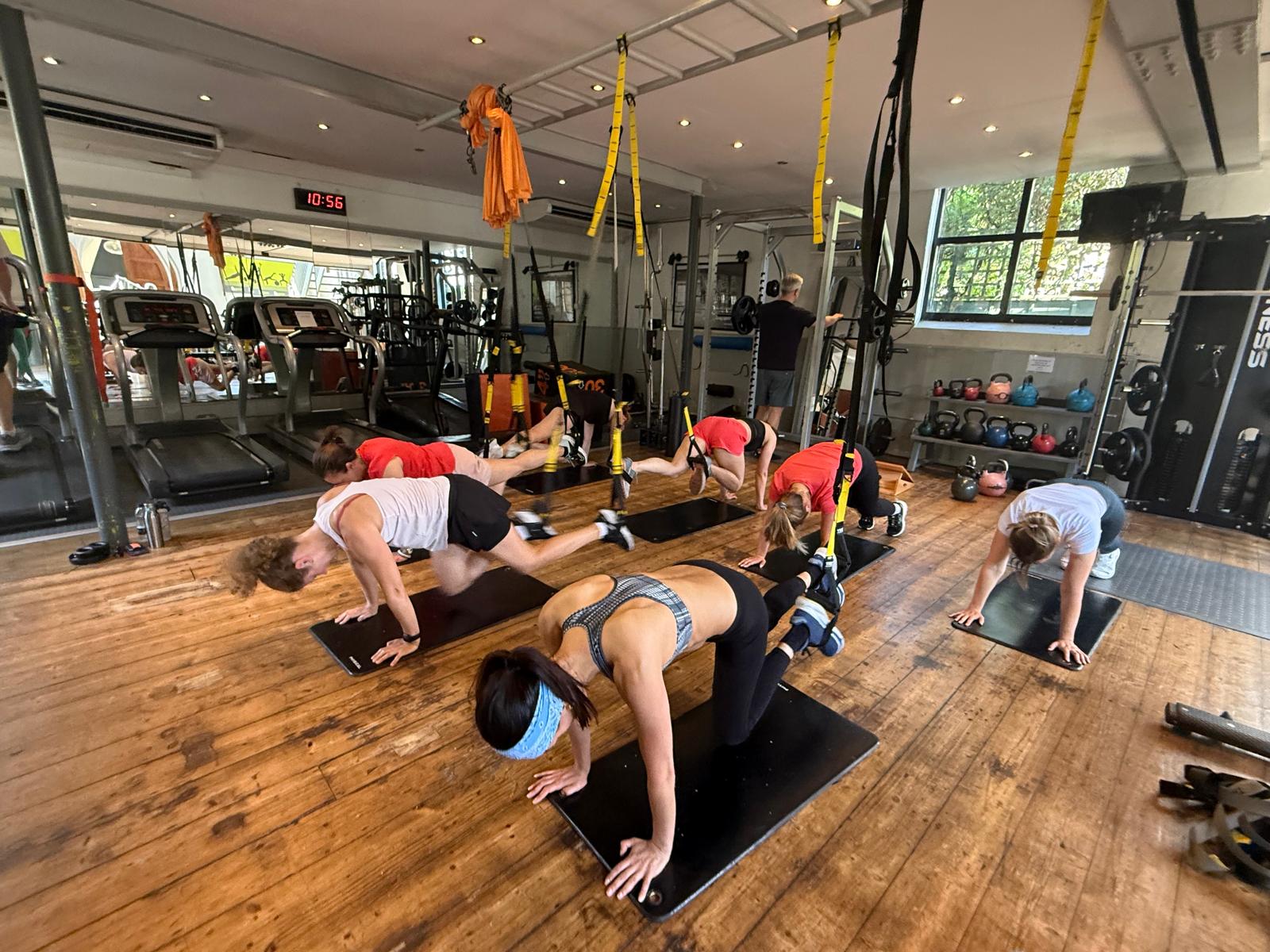 Group TRX training session in the studio